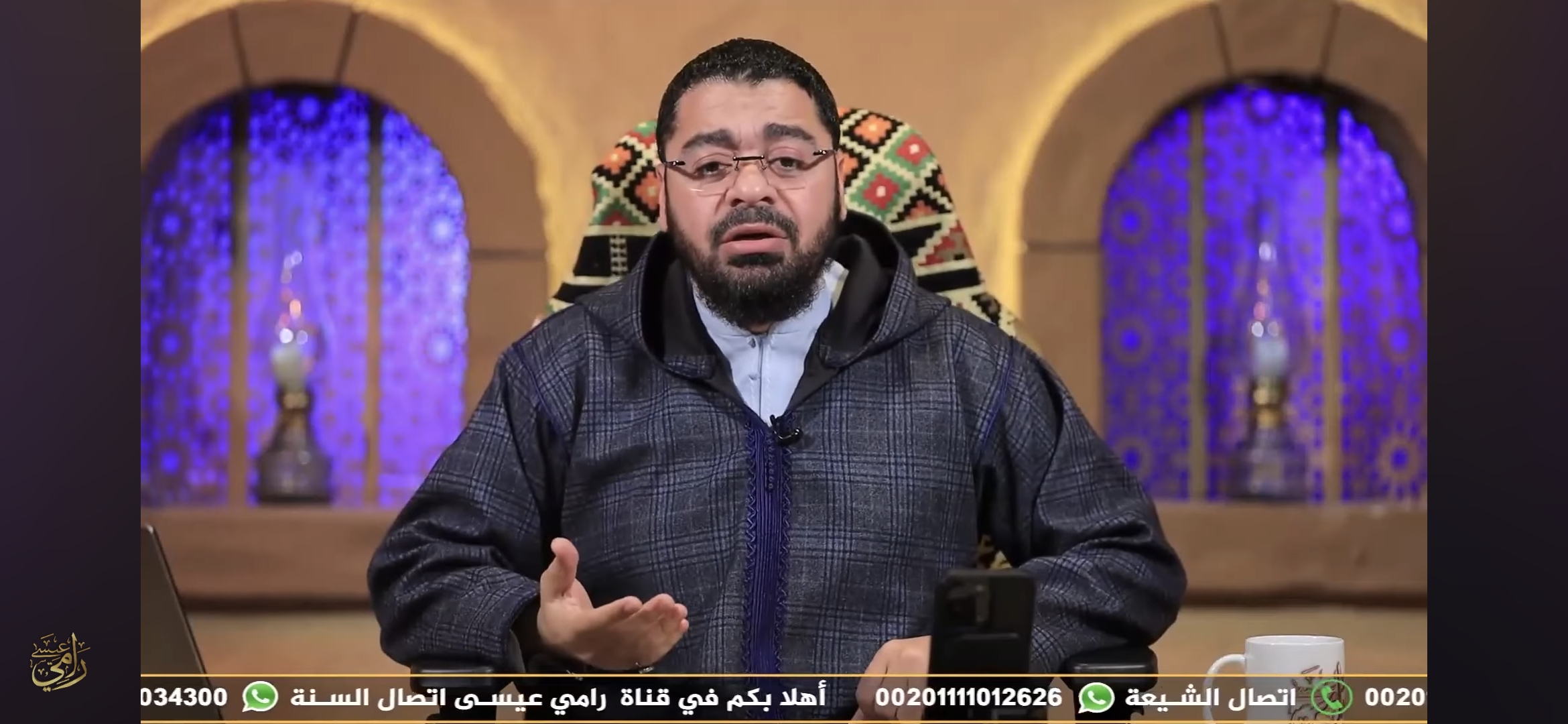 رامي عيسى يتحدى الشيعة: هل حج الخامنئي؟ ورد ناري على فيديو باقر الحسيني المثير للسخرية (فيديو)